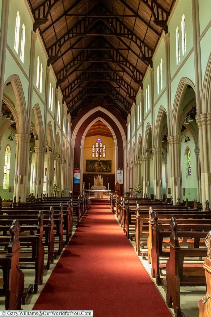 Main Aisle & Handcrafted Teak Pews